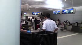 Janet Jackson hides her face as she arrives at LAX Airport in Los Angeles, Ca