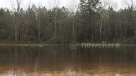 Sprinklers keep working on flooded field