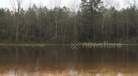 Sprinklers keep working on flooded field