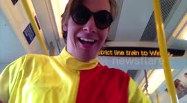 Man, dressed as jockey, rides bike through train carriages in 'urban horse riding' stunt