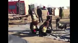 Country artists perform ridiculous headbanging dance to trance music