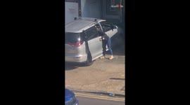 Thief takes advantage of Batman's naptime to steal from a car in broad daylight