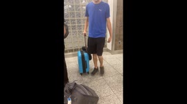 Baby Rides Through Airport Strapped To Carry-On Suitcase