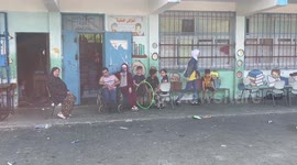 Palestinians fleeing Israeli air strikes take refuge in a school run by the United Nations in Gaza City