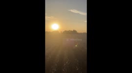 Low-Flying Plane Grazes Farming Machinery