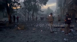 The effects of the destruction left by the Israeli army after the bombing of the Palestine Tower, and here Palestinians inspect their belongings that were inside the tower
