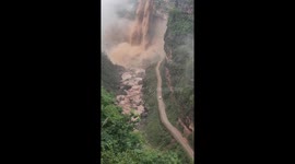 Muddy waterfall in Yunnan: nature's response to heavy rainfall