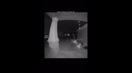 Night sky is shrouded in ominous darkness periodically illuminated by violent streaks of lightning