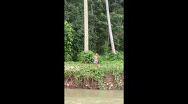 Kid tumbles into river while playing with family