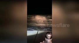 Deer family seen swimming through raging sea in China