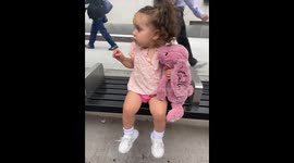 Precious girl and her bunny best friend wait for 'big bus' to take them to museum