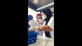 Students practice lab rat handling: balancing act with screams