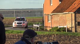On the edge of the canal. This was closed, the car almost drove into the canal during the rally. spectators help him further