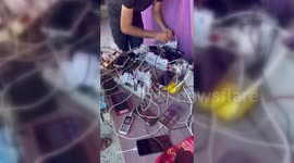Gazans Use Car Batteries To Charge Phones