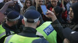A woman challenging a Police officer intimidating a young man at a pro-Palestine rally in London