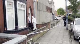 Forensics officers enter a cordoned off property in Hartlepool, UK