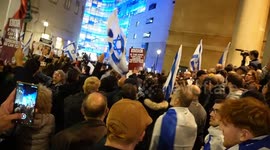 Supporters of Israel sing a prayer at BBC Broadcasting House during protest