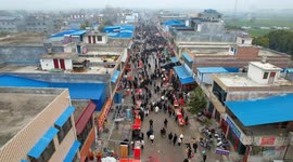 Uygur woman forges friendship, sees growing business in jade town in China's Henan