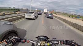 Motorcycle Rider Bumps into Surprise Barrier