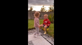 Young Siblings Show Affection Before Shoving