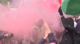 Demonstrators set off smoke flares during Palestine rally in London