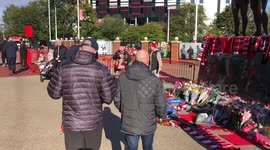 Fans lay flowers at Old Trafford, UK following the death of Sir Bobby Charlton