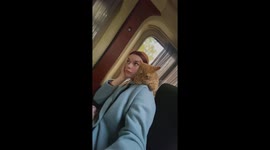 Belarusian beauty: Rita and 6-month-old cat Chipsik's adorable bus ride!