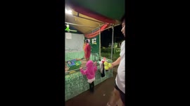 Fair-goer almost hits sleeping man while trying to win prize