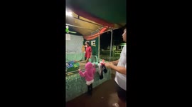 Missed Throw Reveals Someone Sleeping Under Carnival Game