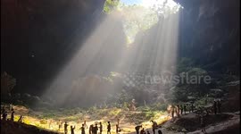 Locals play volleyball in sinkhole in China