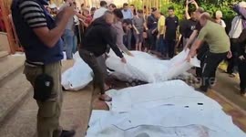 Gazans Gather Victims of tThe Raid in Khan Yunis, Palestine