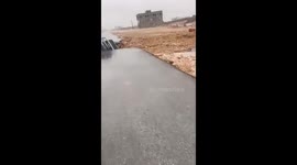 Cars swallowed after Tropical Cyclone Tej opens up road in Yemen