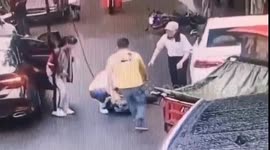 Terrifying moment Chinese motorcyclist nearly strangled by dangling cable on busy road