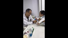 Doctor's Playful Approach Soothes Child During Vaccination in China
