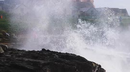 Weather, Big seas break for Half term halloween crowds at Little Fistral beach, Cornwall UK