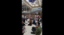 Pro Palestine protesters chant for a free Palestine in Waterloo Station