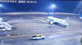 Ground vehicle crashes into parked plane causing damage in southern China