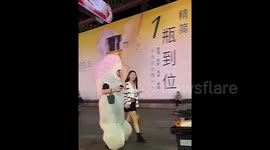 Police in China escort woman off street for her phallic Halloween costume