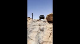 SUV Goes Down Steep Slope