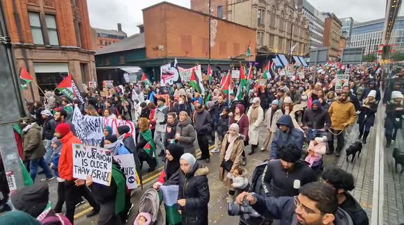 Pro Palestine protest marches through the street of Manchester, England