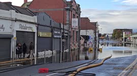 Fire service pump water from flooded premises in Downpatrick Town, UK
