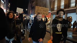 Millions Mask march going from Trafalgar Square to Parliament Square While walking down Whitehall