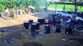 Burning oil drum explodes when worker kicks it