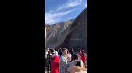 Daredevil tourists capture massive landslide seconds before narrow escape in China