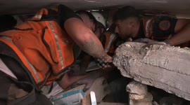 Emergency services battle to rescue residents traped under rubble in Khan Younis
