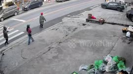 Motorcyclist knocked out by working carrying poles