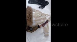 Creative resident washes fur coats in snow in northern China