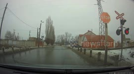 Car Attempts to Run Through Stopped Railroad Crossing