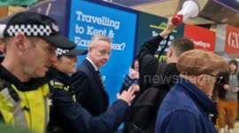 'Michael Gove shame on you!!': Pro-Palestine protesters surround and shout at communities secretary as he passes through London's Victoria Station