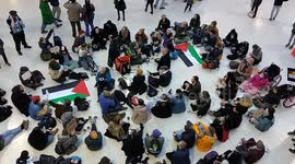Palestine supporters hold sit-in protest at Waterloo station in London, chant 
